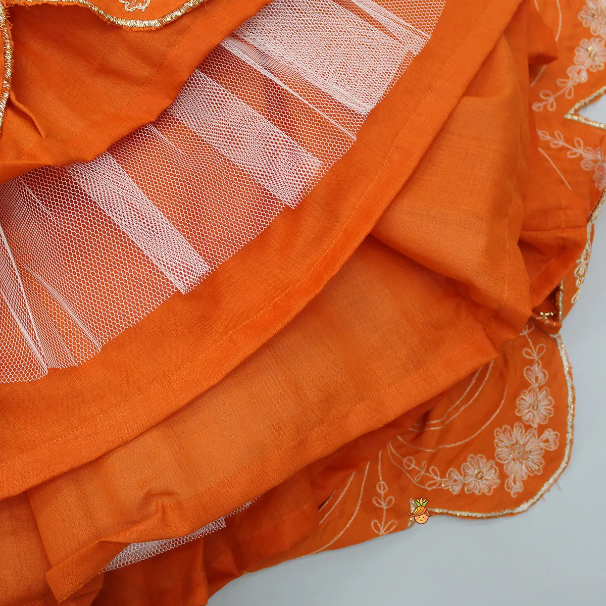 Dual Back Knot Detail Orange Top And Tassels Enhanced Lehenga